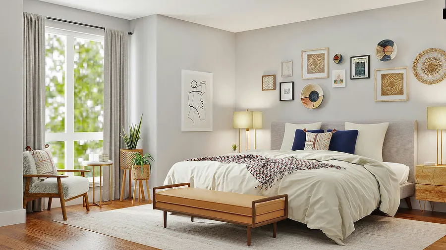 Dormitorio acogedor con una cama grande cubierta de ropa de cama blanca, cojines decorativos, lámparas de mesa en cada lado, un banco de madera a los pies de la cama, plantas en macetas junto a la ventana y decoraciones de arte en la pared.